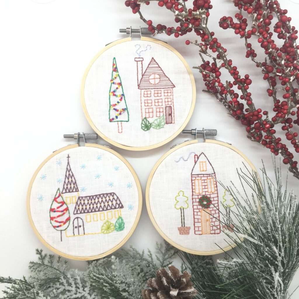 3 Christmas hoops with embroidered houses