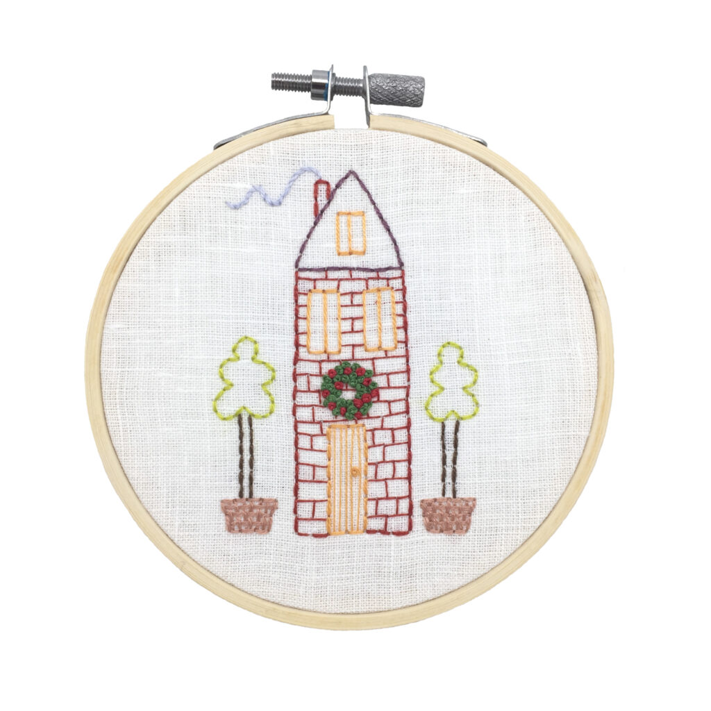 Christmas house with a wreath hand embroidery