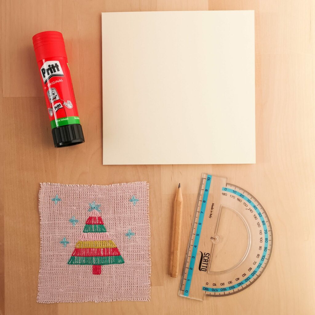 Materials for making a greetings card, glue, ruler, pencil, embroidery, paper card