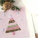 Hand made embroidered Christmas greetings card with Christmas tree