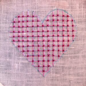 Hand embroidered heart shape with pink threads