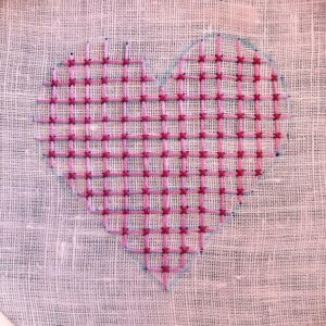 Hand embroidered heart shape with pink threads