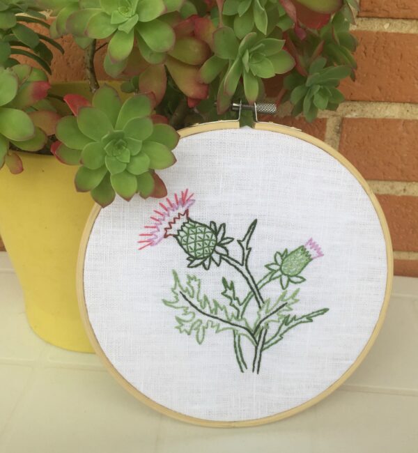 Thistle flower hand embroidery in a hoop wall hanging