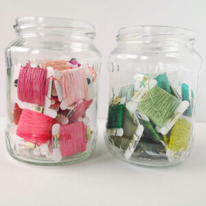 Embroidery floss in a glass jar