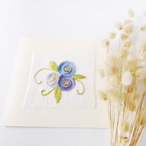 Hand embroidered postcard with blue flowers in chain stitch