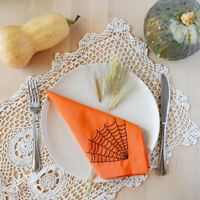 Sustainable Halloween table decor with hand embroiderd fabric napkins