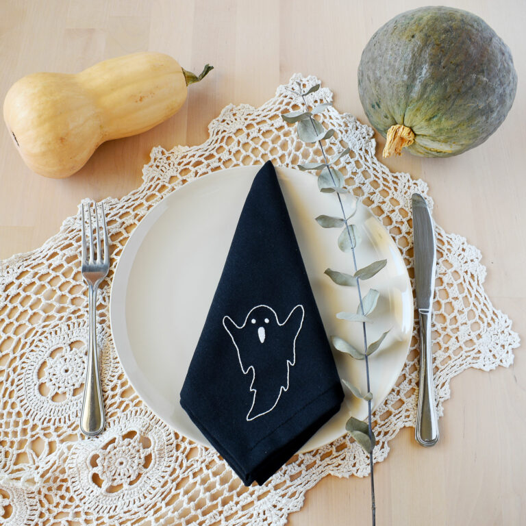 Sustainable halloween table decor with hand embroidered napkins