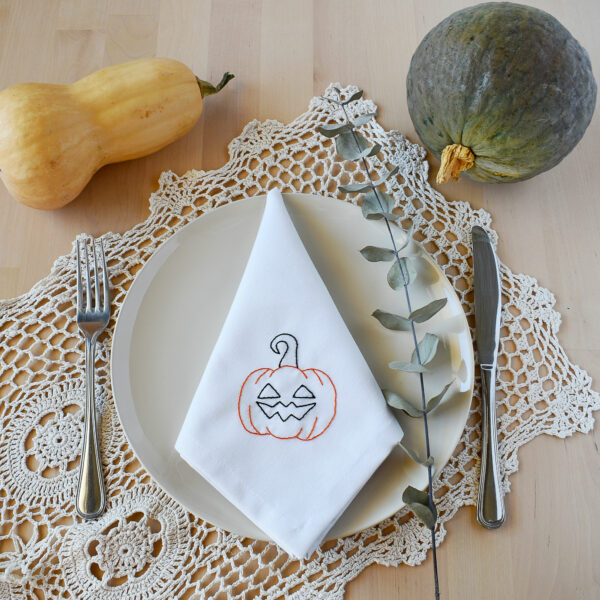 Embroidered fabric napkin with pumpkin design for halloween