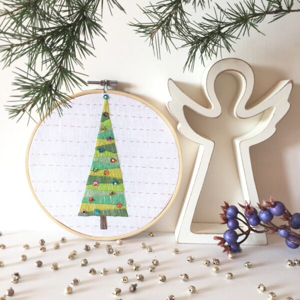 Hand embroidered hoop art with a Christmas tree image