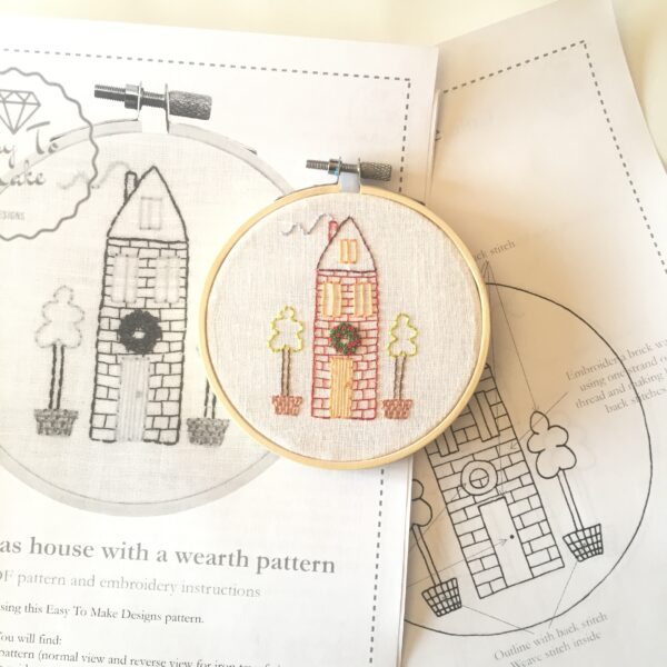 Christmas house with a wreath hand embroidery pattern and instructions